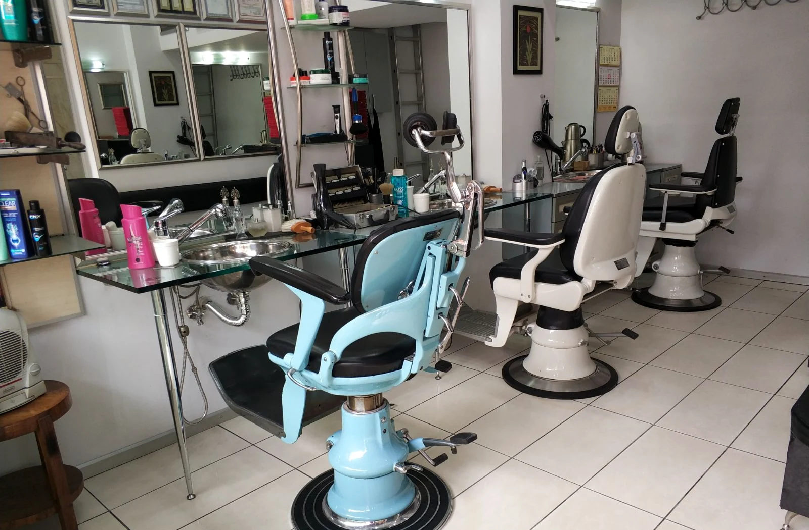 Bright interior of Rimedzo Barber Shop with multiple barber chairs